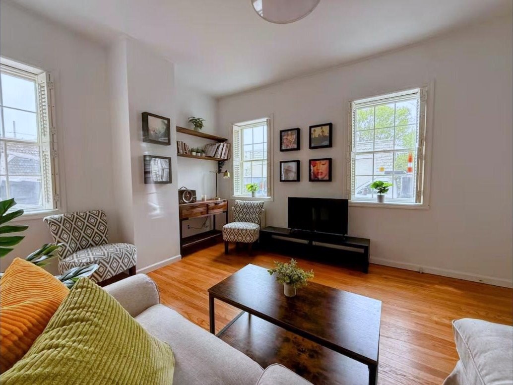 Living room corner with gallery wall and record shelf