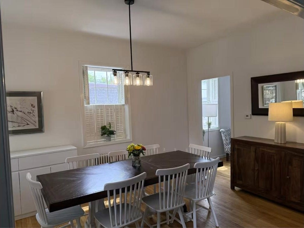 Dining room with farmhouse table seating eight