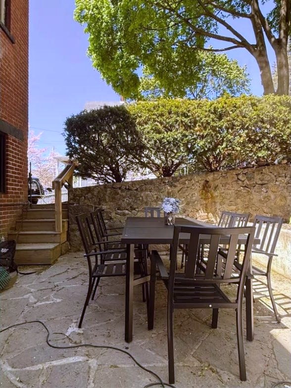 Stone patio with outdoor dining table